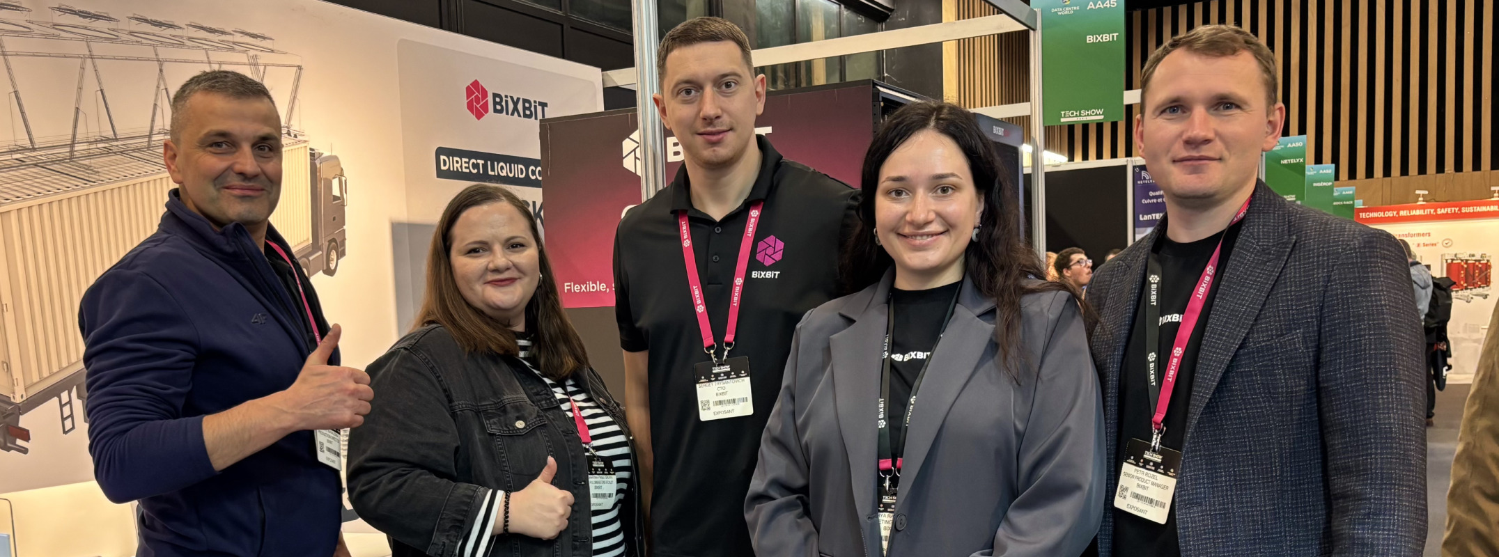 BiXBiT team presenting solutions at DCW Paris 2025 booth